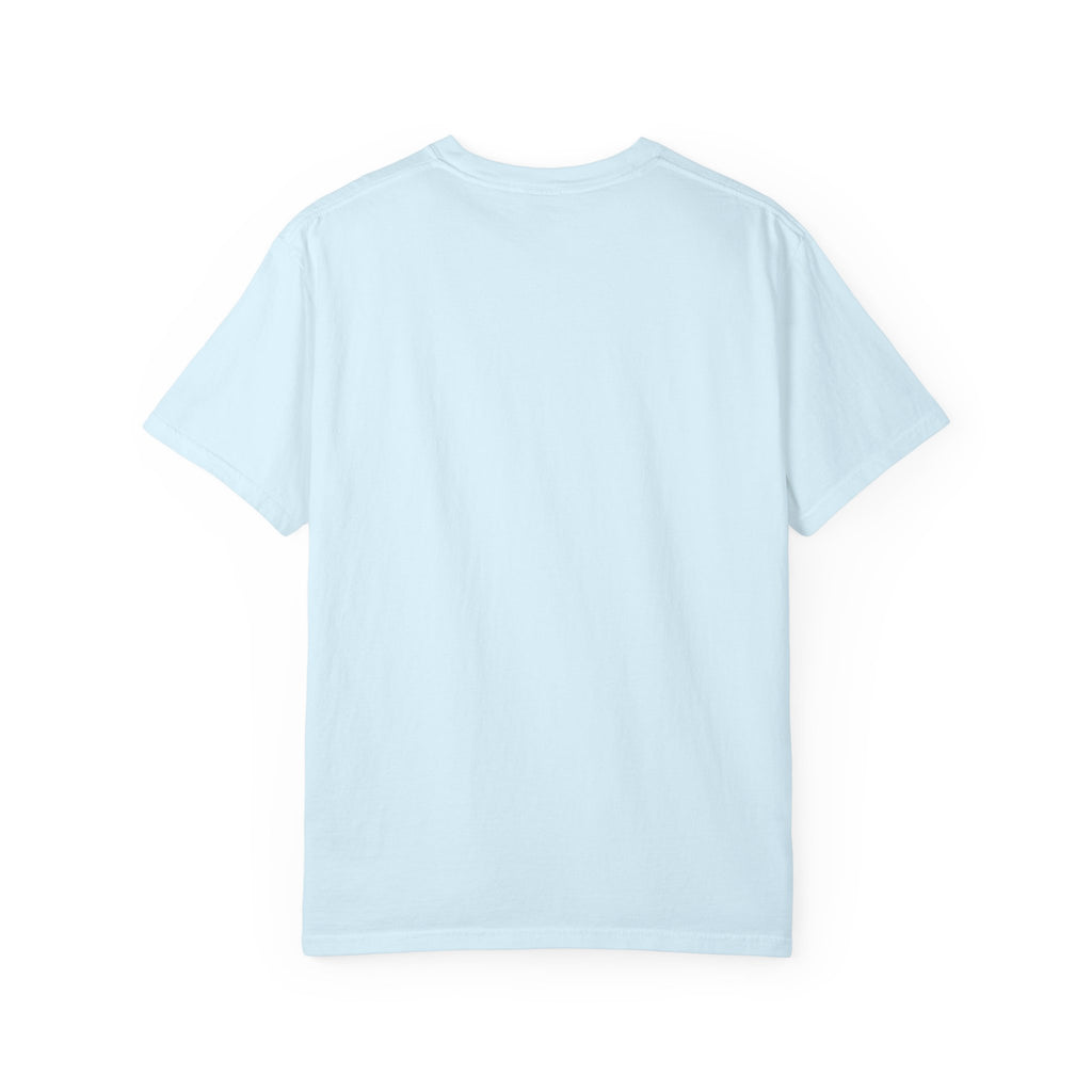 Fantasy book lover tee featuring an enchanted forest, waterfall, and castle emerging from an open book.