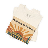 A folded cream-colored t-shirt featuring a retro-style graphic print of Alexandria&