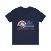 "My Summer Plans Are Booked patriotic t-shirt featuring a woman reading on a beach chair by the water with fireworks, retro rainbow, and red white blue vintage summer design."