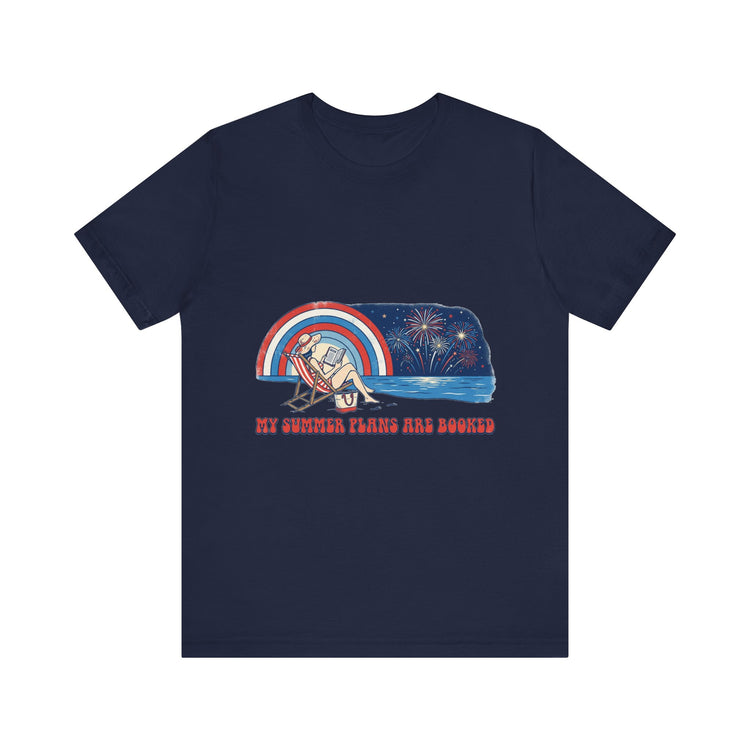 "My Summer Plans Are Booked patriotic t-shirt featuring a woman reading on a beach chair by the water with fireworks, retro rainbow, and red white blue vintage summer design."