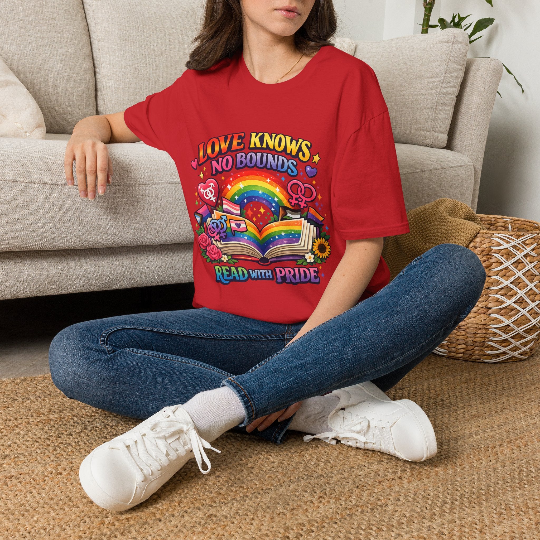 LGBTQ+ book lover tee with rainbow book, pride symbols, and "Love Knows No Bounds, Read With Pride" text.