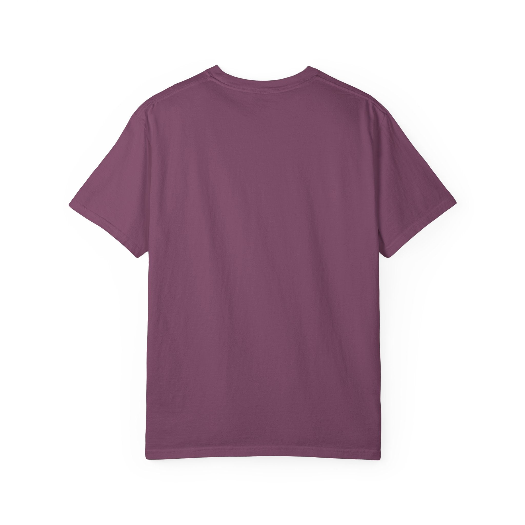 Fantasy book lover tee featuring an enchanted forest, waterfall, and castle emerging from an open book.