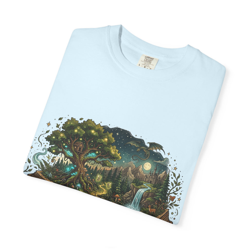 Fantasy book lover tee featuring an enchanted forest, waterfall, and castle emerging from an open book.