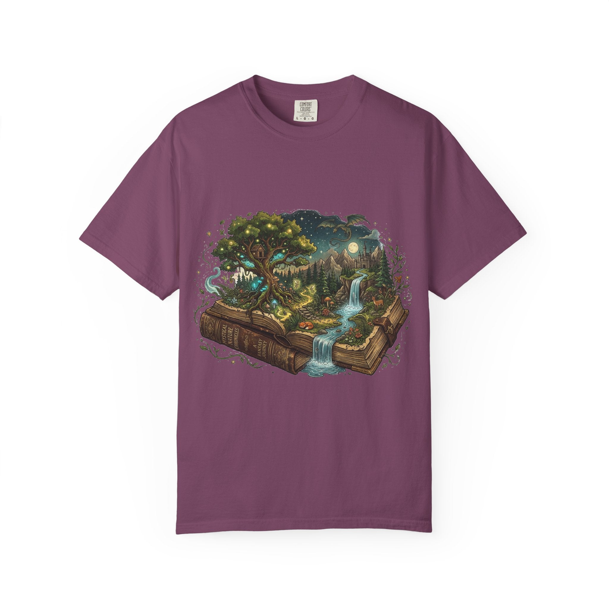 Fantasy book lover tee featuring an enchanted forest, waterfall, and castle emerging from an open book.