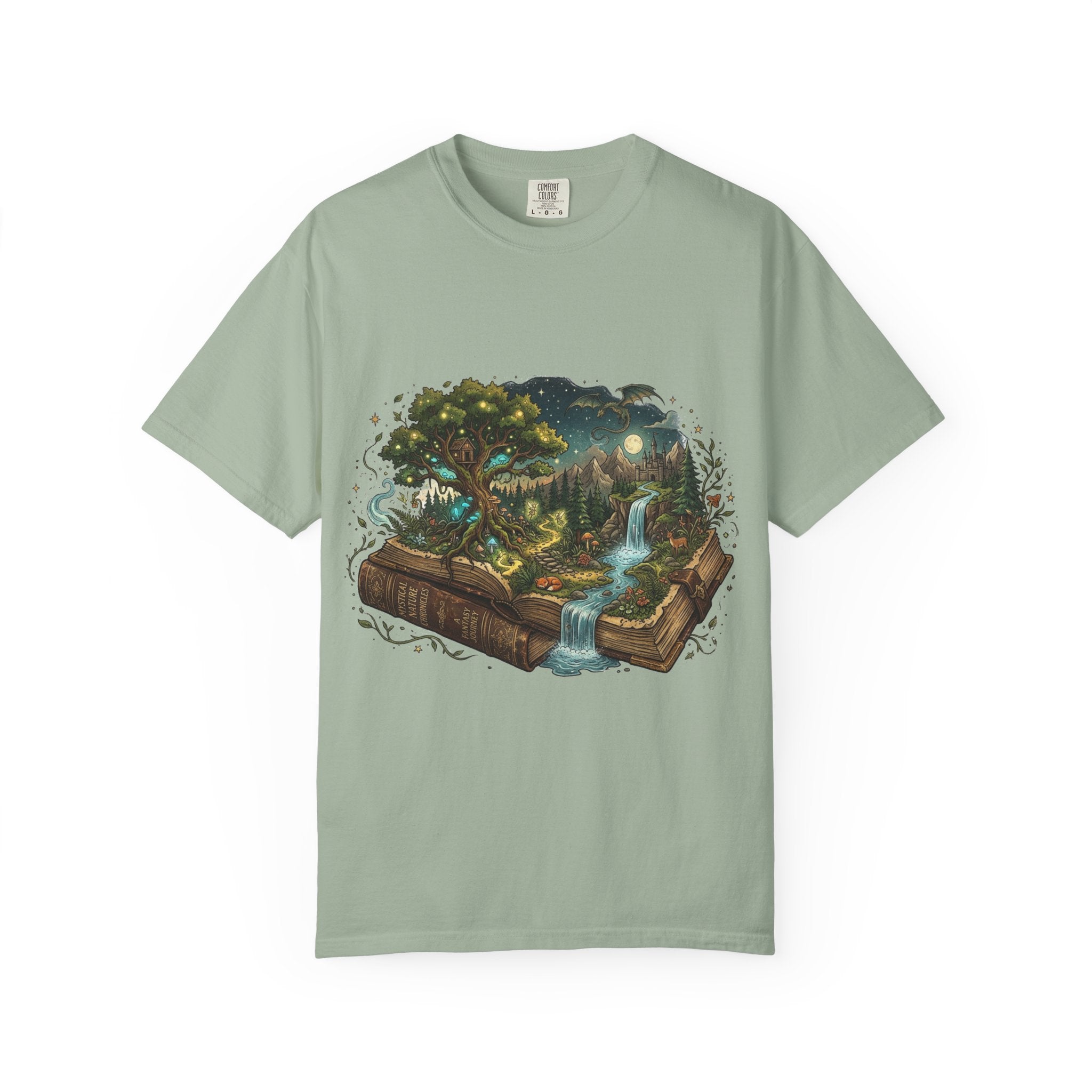 Fantasy book lover tee featuring an enchanted forest, waterfall, and castle emerging from an open book.