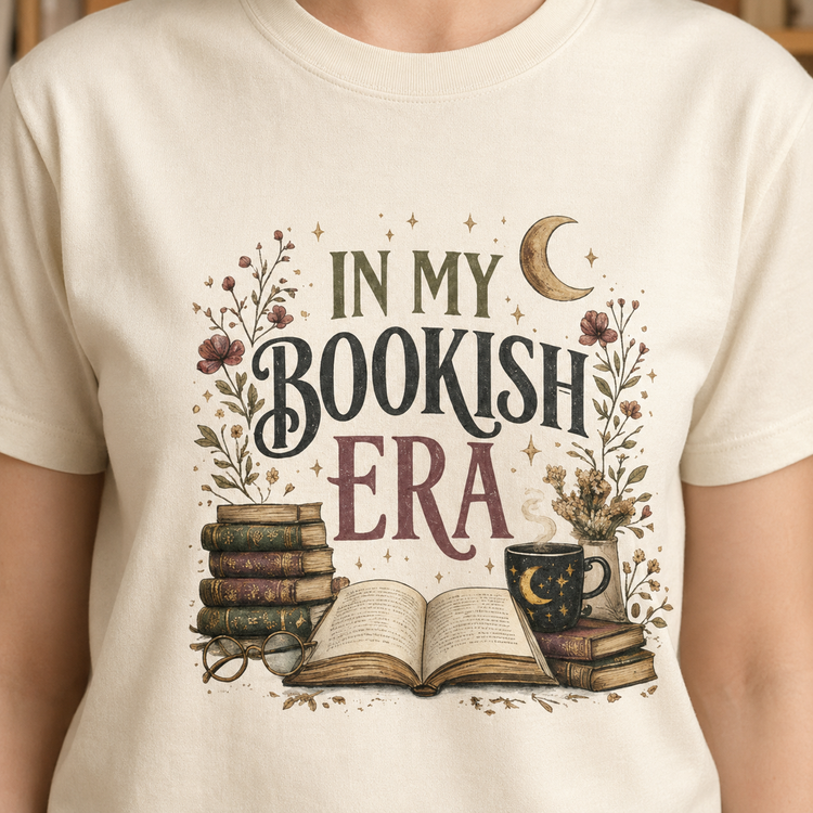 A person wearing a cream-colored t-shirt with a vintage-style graphic that reads &