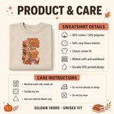 An infographic detailing the product and care instructions for a Gildan 18000 unisex sweatshirt. The graphic features a folded beige sweatshirt with a colorful autumn-themed graphic on the front, alongside text detailing the fabric composition, fit, and care instructions.