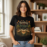 A woman wearing a black graphic t-shirt with a &