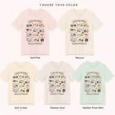 A color selection graphic showing five short-sleeve T-shirts with a sushi-themed chest print, labeled Soft Pink, Natural, Soft Cream, Heather Dust, and Heather Prism Mint.