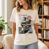 A woman wearing a cream-colored graphic t-shirt with a book-themed print that reads &