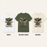Three short-sleeve graphic T-shirts shown side by side on a light beige background, labeled White, Military Green, and Natural. Each shirt features a front graphic of an eagle over stacked books with crossed swords and the text &
