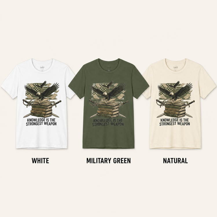 Three short-sleeve graphic T-shirts shown side by side on a light beige background, labeled White, Military Green, and Natural. Each shirt features a front graphic of an eagle over stacked books with crossed swords and the text &