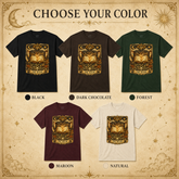 A color selection graphic for a graphic t-shirt featuring five color options: Black, Dark Chocolate, Forest, Maroon, and Natural. Each option shows a short-sleeve crewneck t-shirt with a detailed gold and brown illustration of an open book under a crescent moon and stars, labeled &