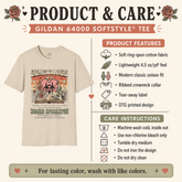 A product and care infographic for the Gildan 64000 Softstyle Tee. The graphic features a beige crewneck t-shirt with a colorful graphic print on the front, alongside detailed product features and care instructions on a light cream background.