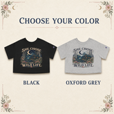 A color selection graphic for a cropped graphic T-shirt showing two versions of the same shirt design: one black and one heather gray, with the text &