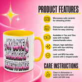 A white ceramic mug with a yellow handle and interior, featuring the text &