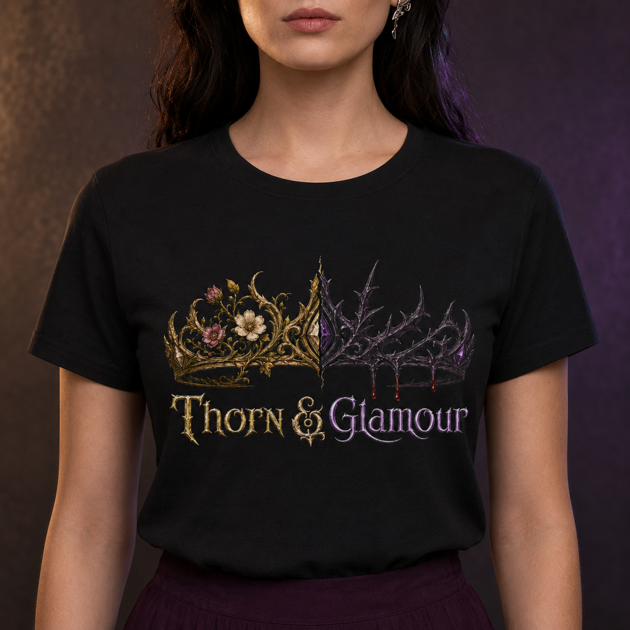 A woman wearing a black short-sleeve graphic T-shirt with a decorative crown design and the words &