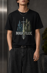 A man wearing a black short-sleeve graphic t-shirt with a metallic fantasy sword and cityscape design, featuring the text &