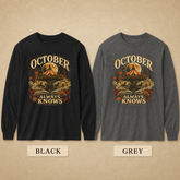 Two long-sleeve graphic shirts shown side by side on a beige textured background, labeled BLACK and GREY. Each shirt has a large vintage-style autumn graphic with the words &