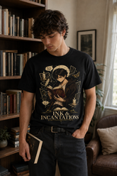A man wearing a black graphic t-shirt with a gothic illustration and the text &
