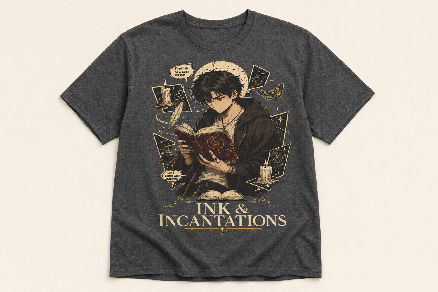A dark heather gray graphic t-shirt featuring an illustration of a young male wizard reading a book, surrounded by tarot cards, a quill, and candles, with the text &