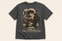 A dark heather gray graphic t-shirt featuring an illustration of a young male wizard reading a book, surrounded by tarot cards, a quill, and candles, with the text &