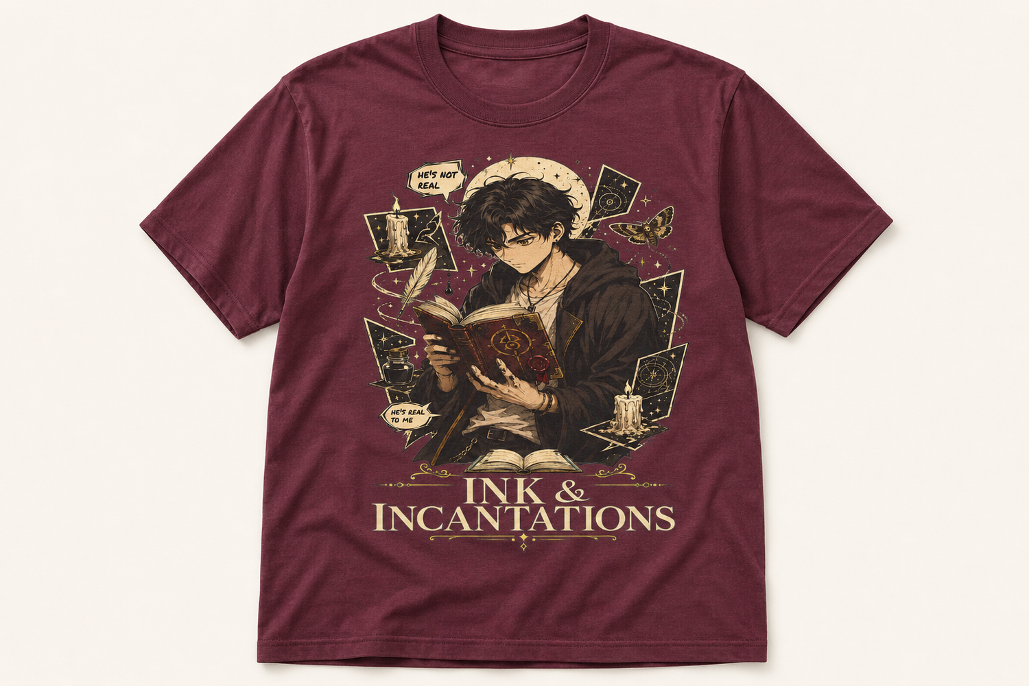 A maroon short-sleeve graphic t-shirt featuring an illustration of a young man reading a book surrounded by ink, quills, and cards, with the text &