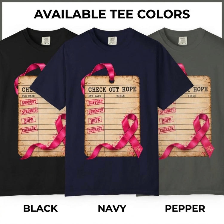 Three short-sleeve T-shirts shown side by side labeled Black, Navy, and Pepper, with the center navy shirt featured prominently. The shirts display a large front graphic of a clipboard reading &