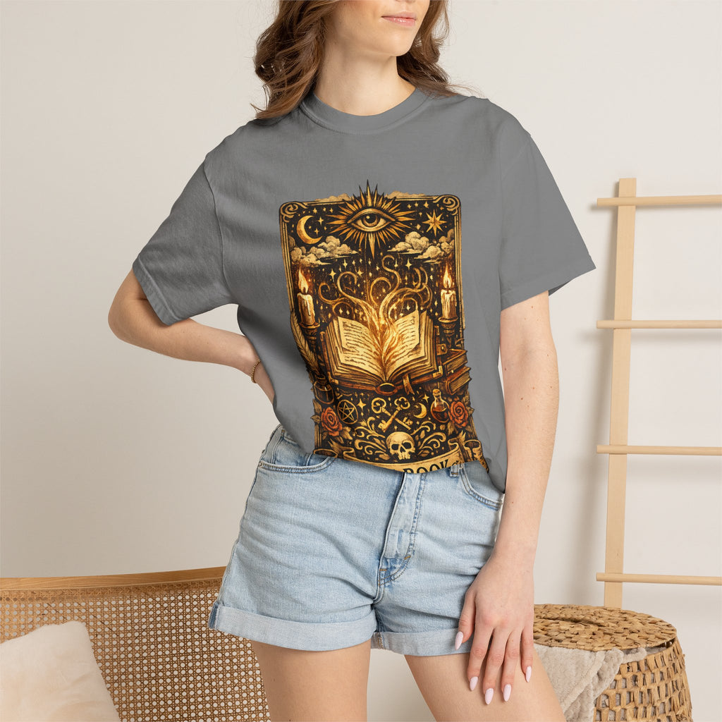 Person wearing a gray t-shirt with a graphic design, standing against a neutral background.