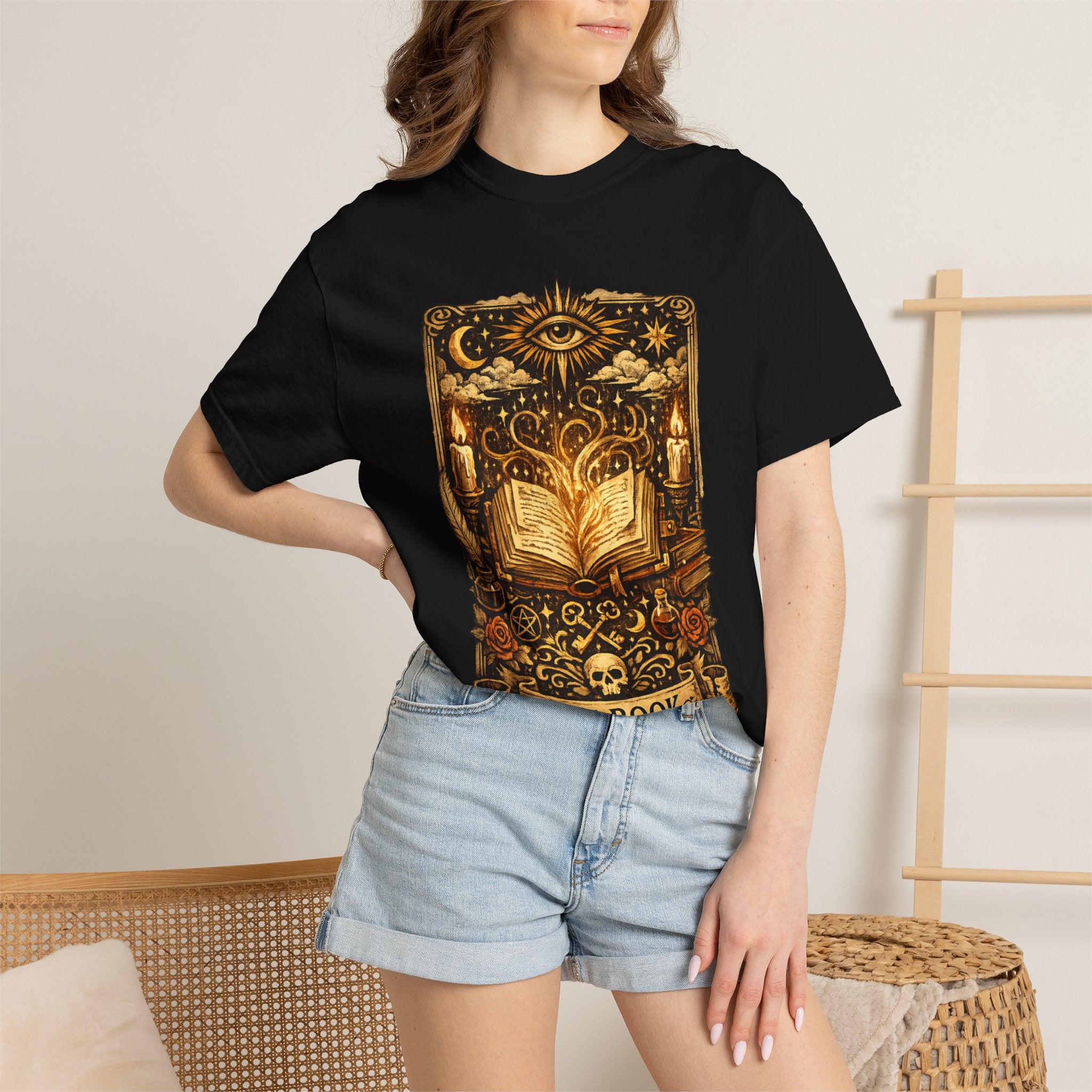 Person wearing a black t-shirt with colorful text design.