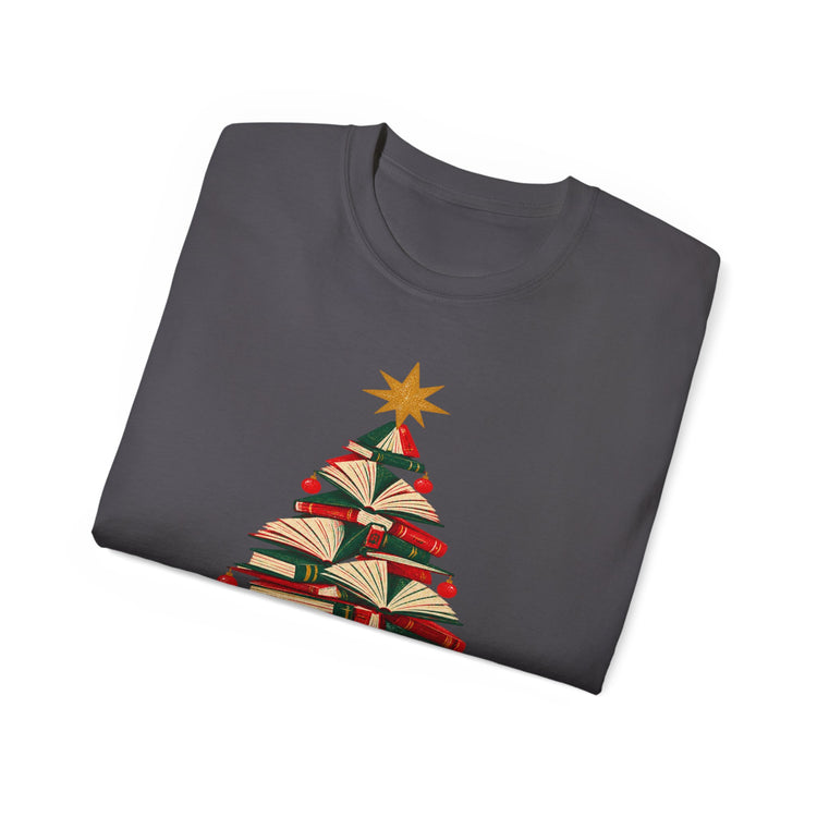 A dark gray folded crewneck t-shirt featuring a graphic of a Christmas tree made from stacked open books with a gold star on top, set against a plain white background.