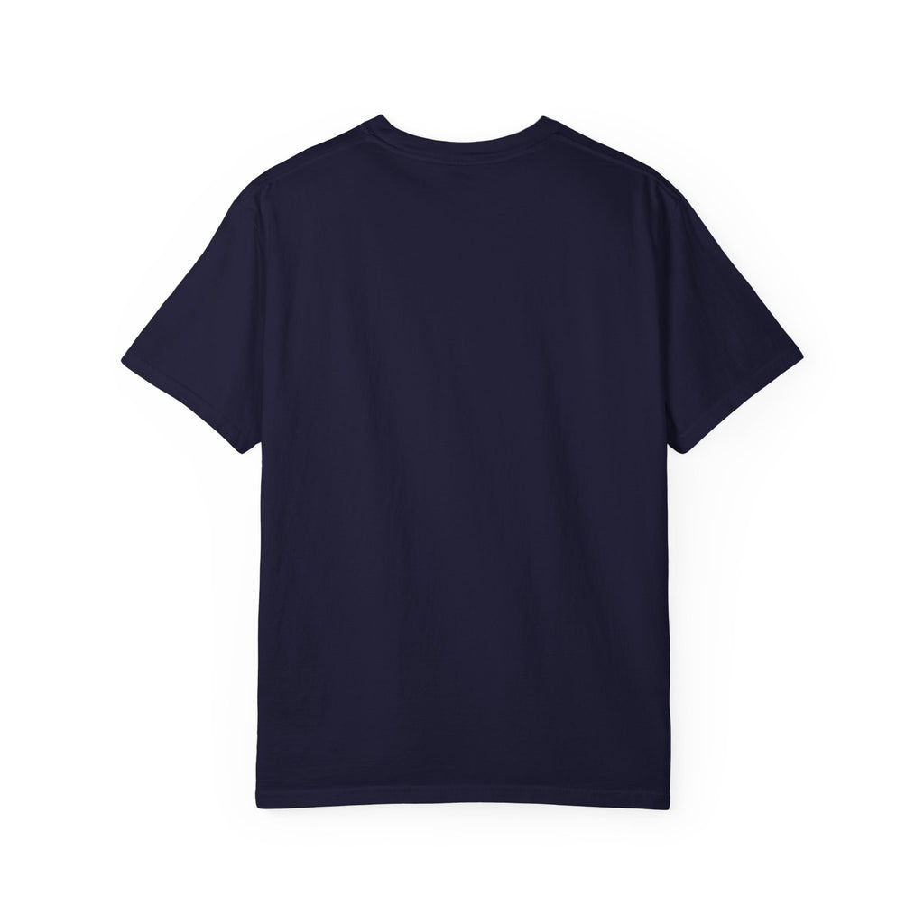 Fantasy book lover tee featuring an enchanted forest, waterfall, and castle emerging from an open book.