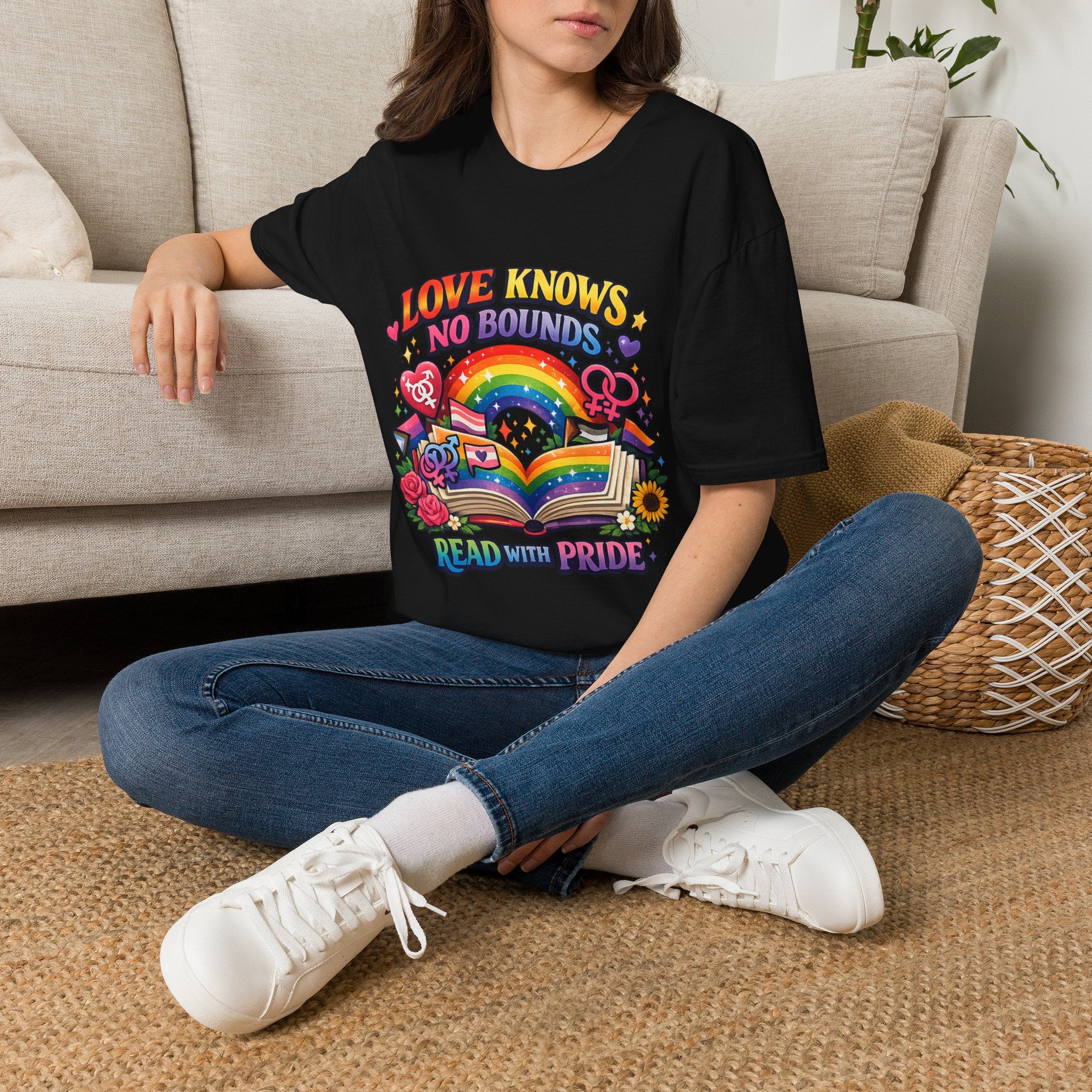 LGBTQ+ book lover tee with rainbow book, pride symbols, and "Love Knows No Bounds, Read With Pride" text.