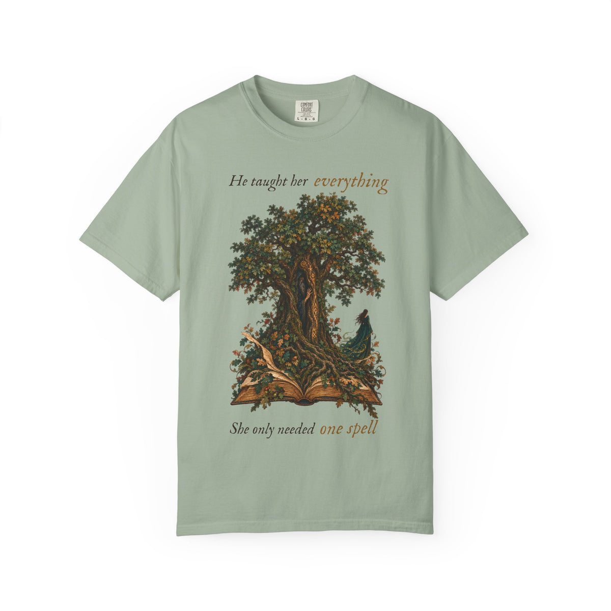 A sage green short-sleeve t-shirt with a graphic of a tree and an open book with a bird, featuring the text &
