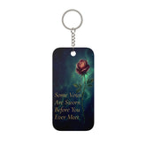Keychain with a rose and text