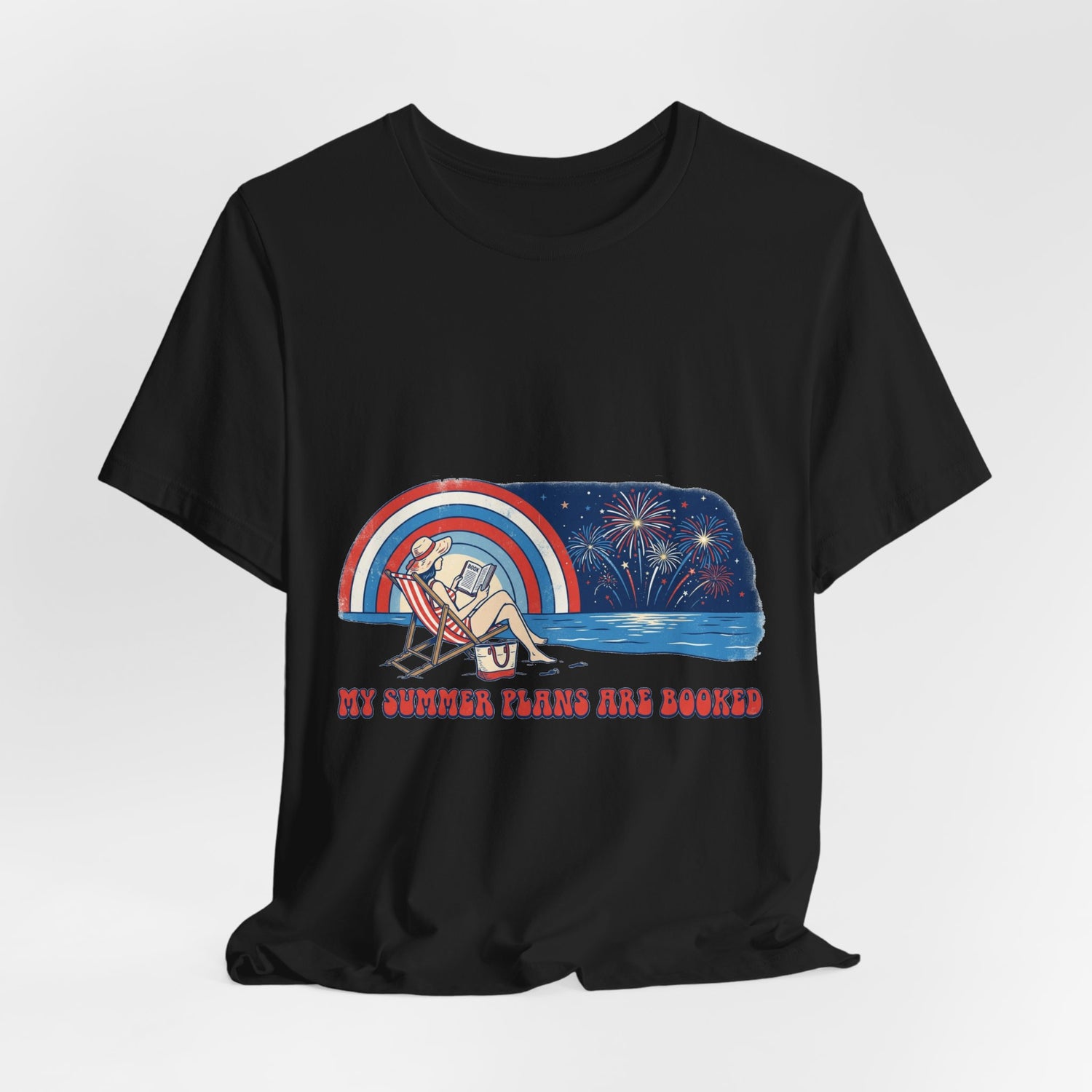 Black t-shirt with a graphic design of a beach scene with a rainbow and text on a white background