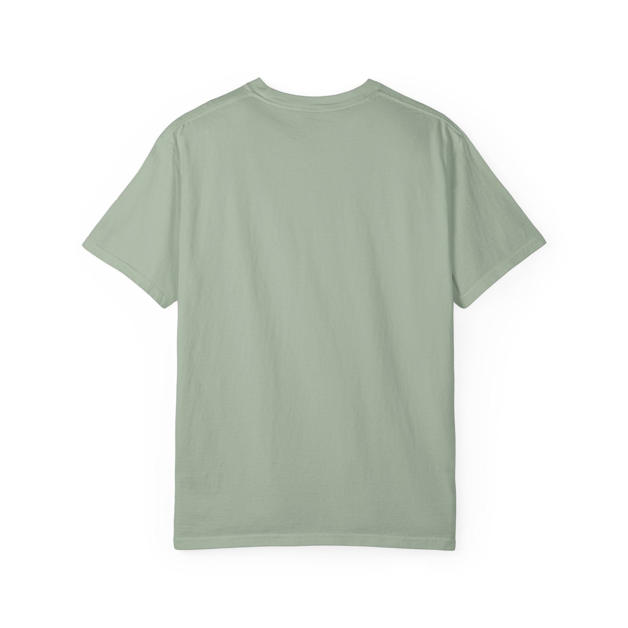 Fantasy book lover tee featuring an enchanted forest, waterfall, and castle emerging from an open book.