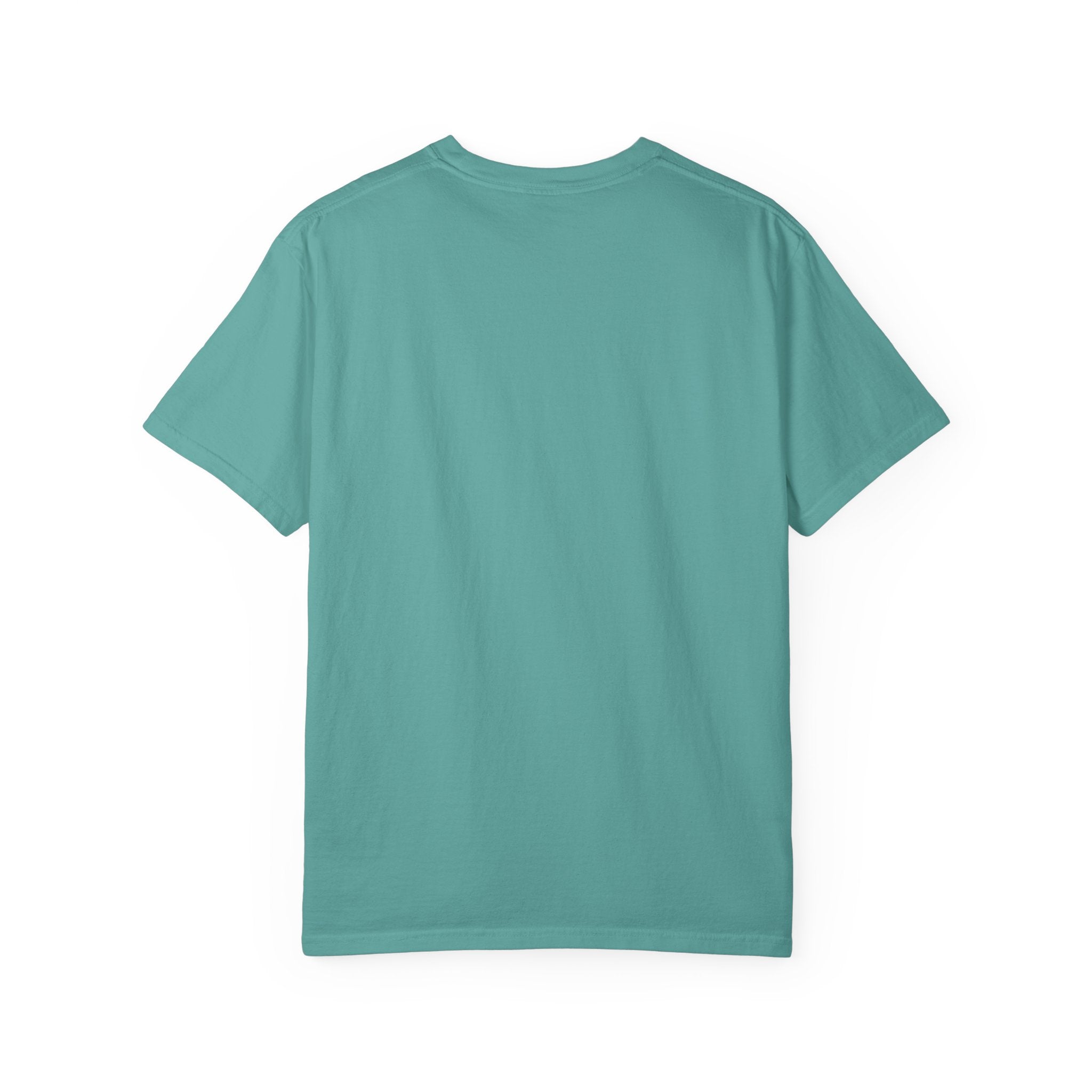 Fantasy book lover tee featuring an enchanted forest, waterfall, and castle emerging from an open book.