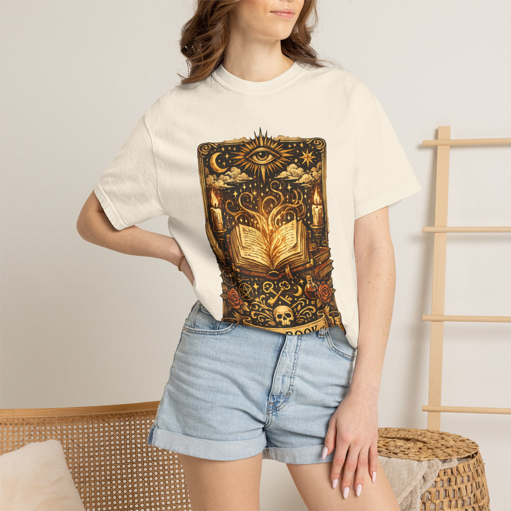 Person wearing a white t-shirt with a graphic design, standing against a neutral background.