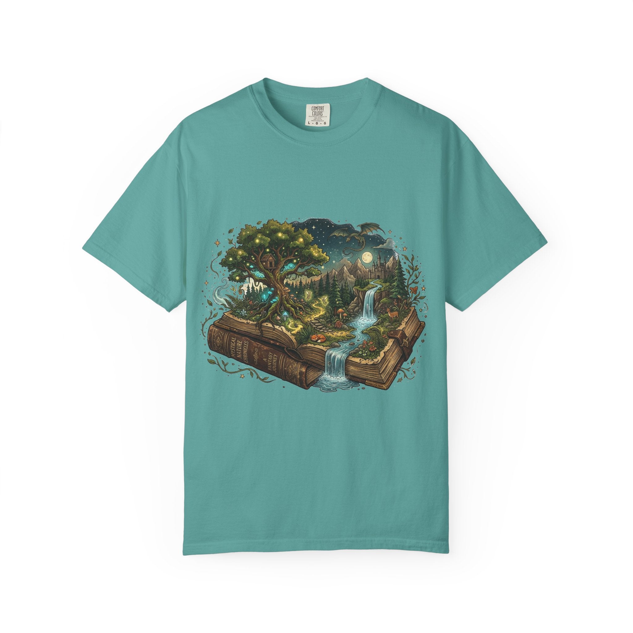 Fantasy book lover tee featuring an enchanted forest, waterfall, and castle emerging from an open book.