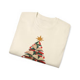 A folded cream-colored crewneck sweatshirt featuring a graphic of a Christmas tree made from stacked books with red ribbons and a gold star on a white background.