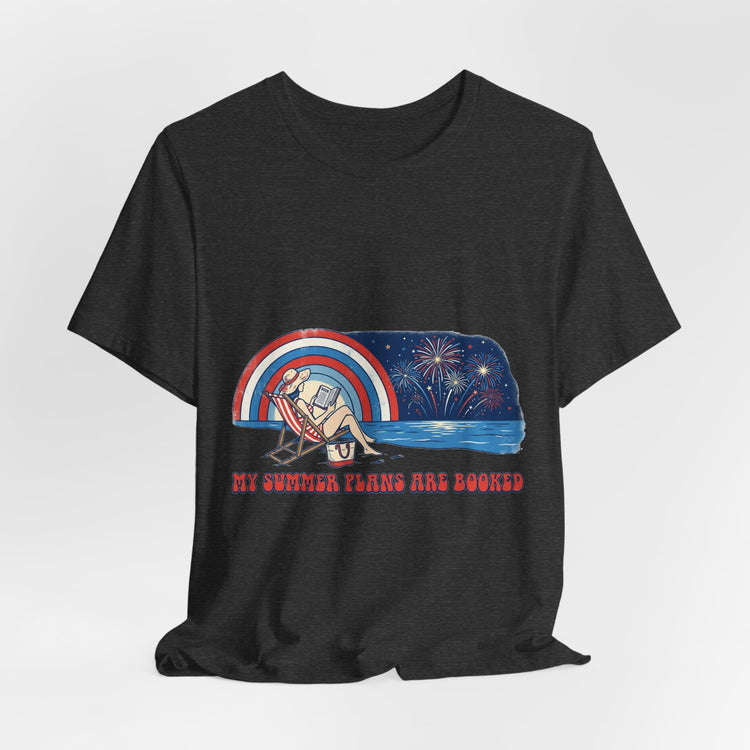 Charcoal t-shirt with a graphic design of a person on a beach chair, fireworks, and text &