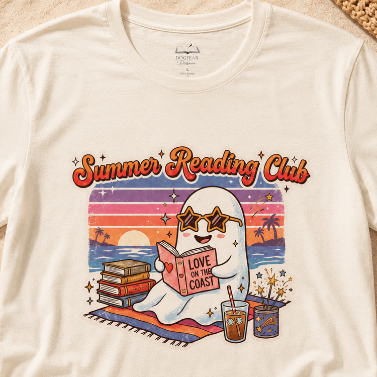 An off-white crewneck t-shirt featuring a colorful retro graphic of a ghost reading a book on a beach with the text &