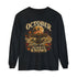 A black long-sleeve t-shirt with a vintage-style Halloween graphic on the front. The graphic features a circus tent under a full moon, a haunted house, autumn leaves, and the text &