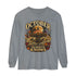 A gray long-sleeve t-shirt with a vintage-style Halloween graphic on the front. The graphic features a haunted house, a glowing full moon, a red-and-yellow circus tent, autumn leaves, and the text &