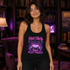A woman wearing a black racerback tank top with a colorful graphic print that reads &